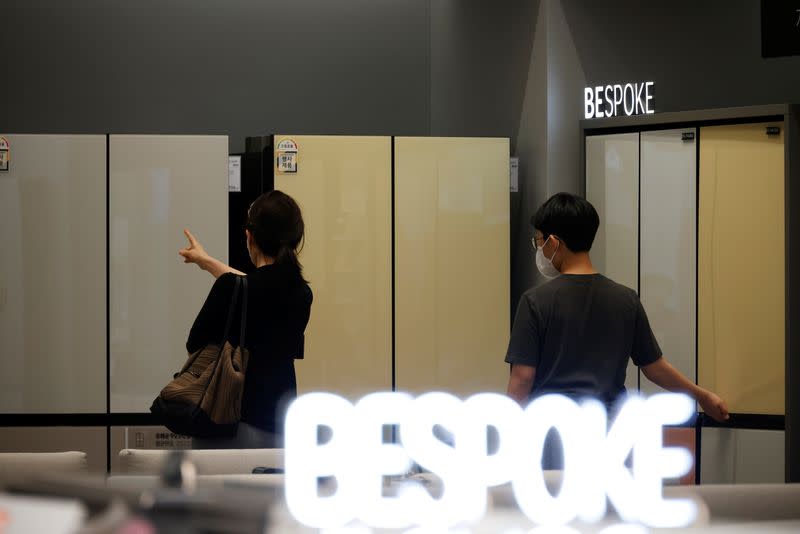 A woman and her son look around Samsung Electronics' BESPOKE refrigerators on display at its store in Seoul