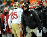 Jan 5, 2014; Green Bay, WI, USA; San Francisco 49ers head coach Jim Harbaugh smiles after tight end Vernon Davis (85) caught a 28-yard pass for a touchdown during the game against the Green Bay Packers in the 2013 NFC wild card playoff football game at Lambeau Field. Mandatory Credit: Benny Sieu-USA TODAY Sports