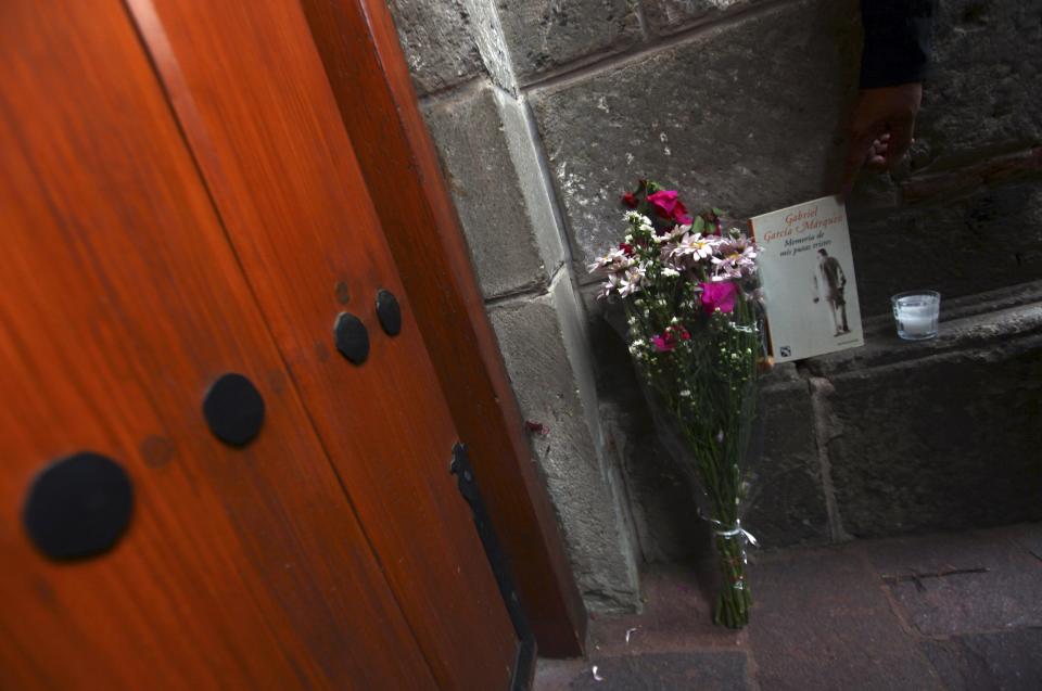 Flowers and the book "Memorias de mis putas tristes" (Memories of My Melancholy Whores) written by Colombian Nobel Prize laureate Gabriel Garcia Marquez are placed outside Marquez's in Mexico