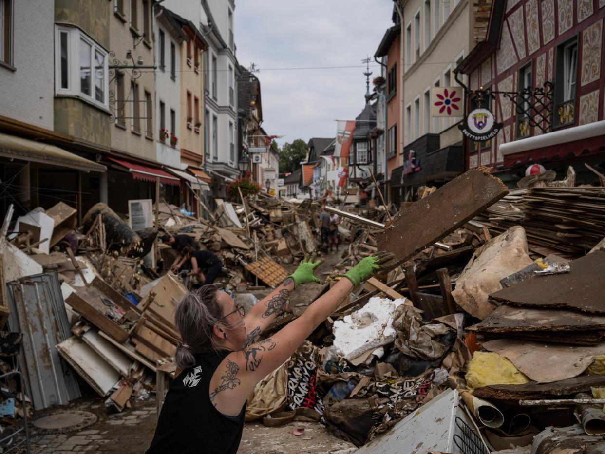 German citizens help clean damage and debris after severe flooding hit the country.