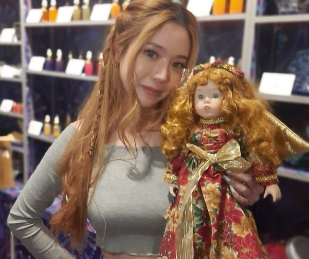 Bambi Leong, a self-proclaimed clairvoyant, has a collection of books of spells and dolls in her shop in Sim Lim Square electronics mall. — Picture via Facebook/BambiNe