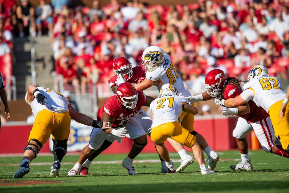 Arkansas defensive tackle Cam Ball makes a tackle during the Razorbacks' win over Kent State earlier this year.