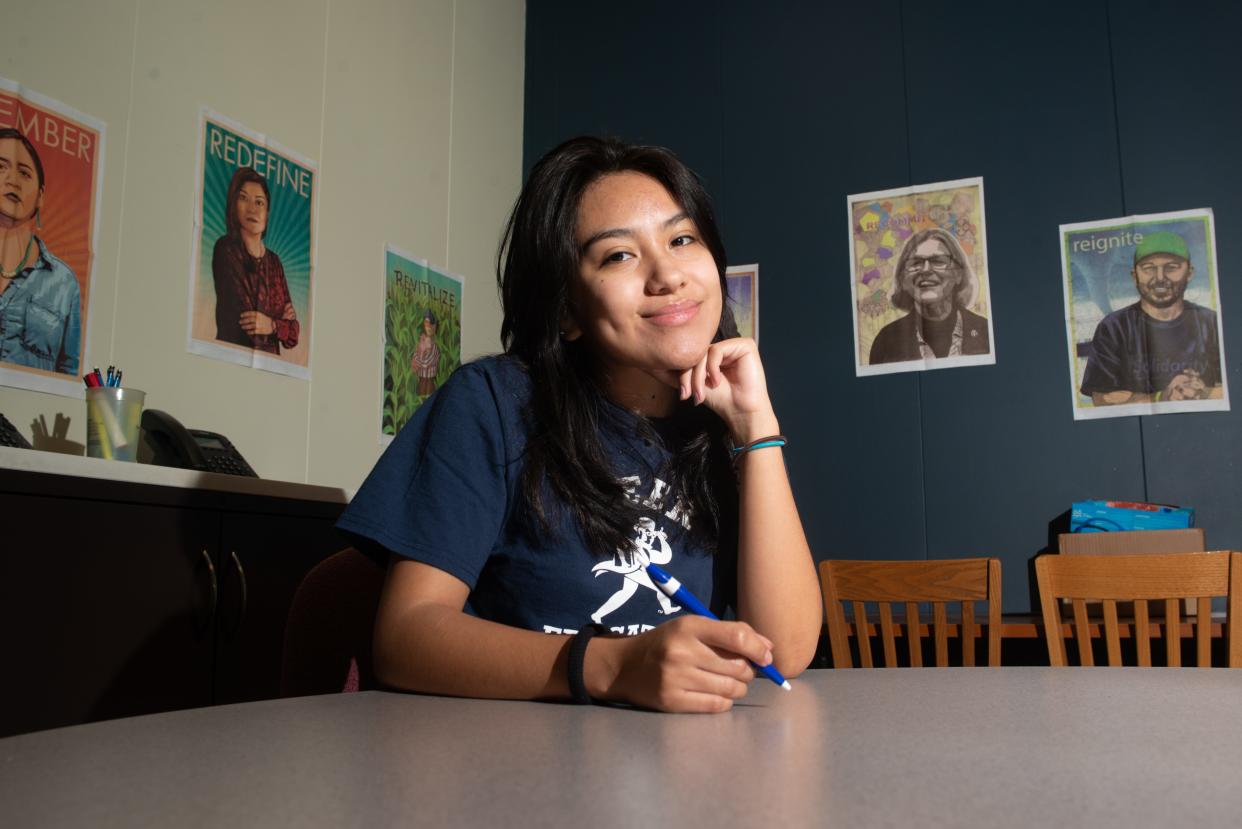 Washburn senior Perla Soto smiles from within the First Year Experience room at Mabee Library Wednesday morning. Soto is one of the estimated 47% of first-generation students identified on campus.