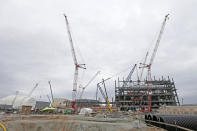 FILE - Construction is seen on two new nuclear reactors at the V.C. Summer Nuclear Station during a media tour in Jenkinsville, S.C., on Sept. 21, 2016. The owners abandoned the South Carolina reactors in 2017 after contractor Westinghouse Electric Co. declared bankruptcy, while construction continued on two new reactors in Georgia. (AP Photo/Chuck Burton, File)