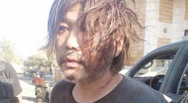 A clearly dishevelled Haruna Yukawa was paraded by his captors through the streets and on social media. Photo: Twitter
