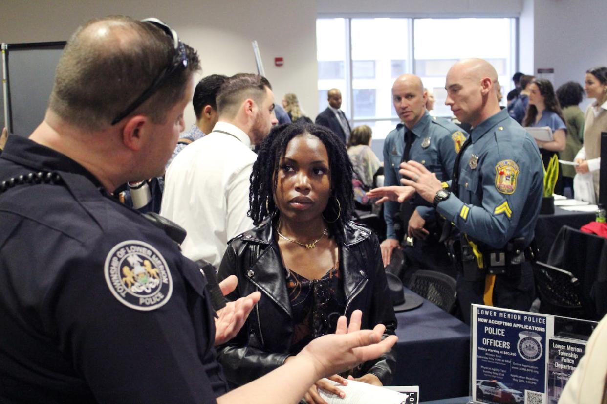 Police officers talk to students during a recruiting event at Temple University. <a href="https://www.gettyimages.com/detail/news-photo/philadelphia-pa-an-officer-from-the-lower-merion-police-news-photo/1258234246" rel="nofollow noopener" target="_blank" data-ylk="slk:Robert Klemko/The Washington Post via Getty Images;elm:context_link;itc:0;sec:content-canvas" class="link ">Robert Klemko/The Washington Post via Getty Images</a>