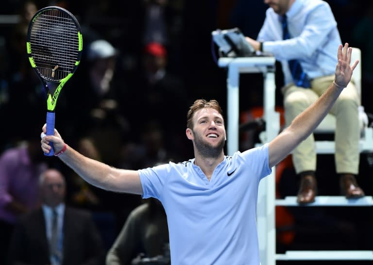 US player Jack Sock celebrates beating Germany's Alexander Zverev in their match on day five of the ATP World Tour Finals tennis tournament in London on November 16, 2017