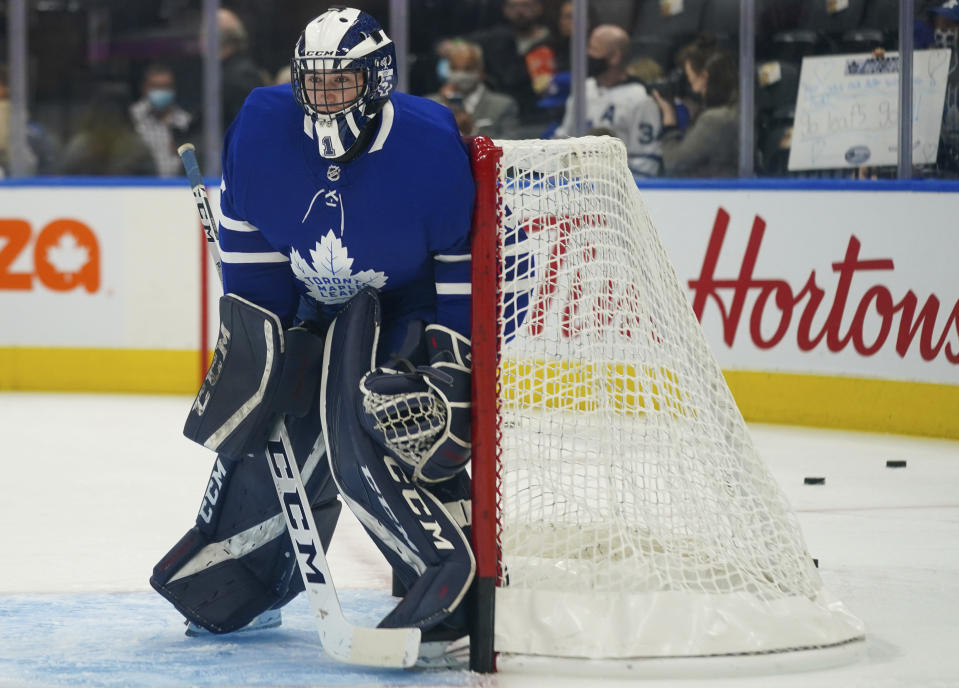 Toronto Maple Leafs goaltender Alexander Bishop warms up before an NHL hockey game against the Ottawa Senators in Toronto, Saturday, Oct. 16, 2021. The Maple Leafs signed the University of Toronto player to a one-day amateur tryout as a backup goaltender. (Evan Buhler/The Canadian Press via AP)