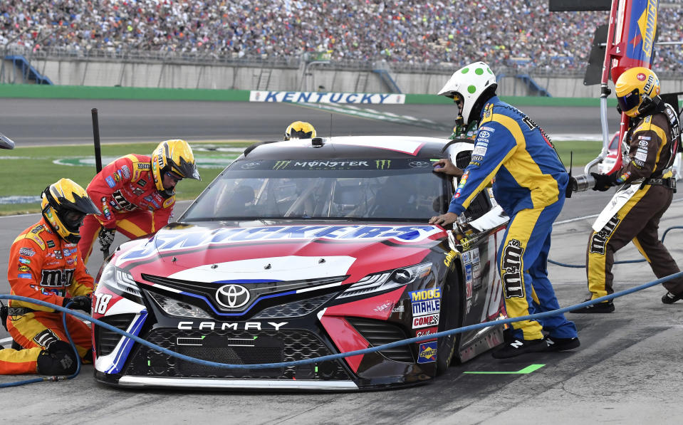 Kyle Busch comes in for a pit stop during the NASCAR Cup auto race at Kentucky Speedway, Saturday, July 8, 2017, in Sparta, Ky. (AP Photo/Timothy D. Easley)