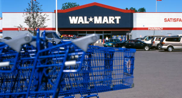 Blue shopping carts in a Walmart store parking lot North America