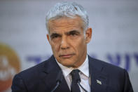 REPLACES COMMON GOOD INSTEAD OF COMMON GROUND - Israeli opposition leader Yair Lapid, speaks during a news conference in Tel Aviv, Thursday, May. 6, 2021. Lapid called on his potential partners to find "common good" and expressed optimism that a new coalition government would be formed. (AP Photo/Oded Balilty)