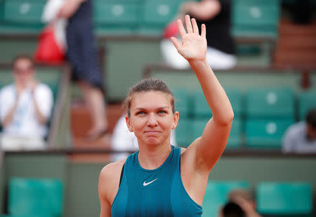 Tennis - French Open - Roland Garros, Paris, France - May 31, 2018 Romania's Simona Halep celebrates after winning her second round match against Taylor Townsend of the U.S. REUTERS/Charles Platiau