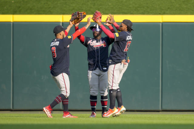 Braves end Reds' 12-game streak in thrilling slugfest