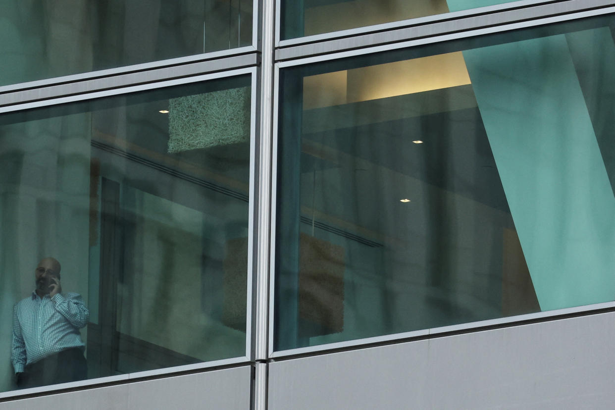 A man talks on a phone on a floor of the global headquarters of  Goldman Sachs investment banking firm at 200 West Street in New York City, U.S., January 11, 2023.  REUTERS/Shannon Stapleton