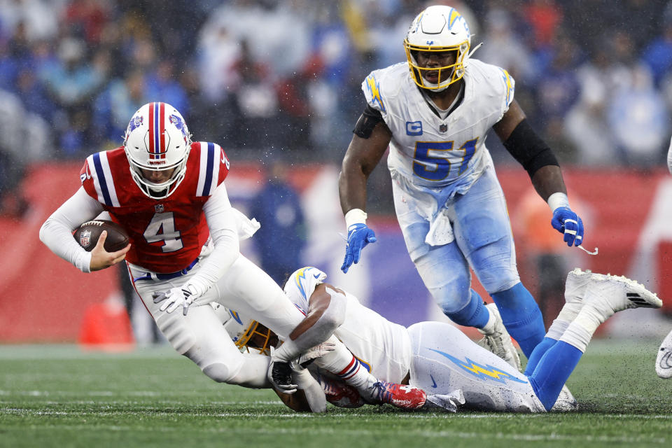 New England Patriots quarterback Bailey Zappe (4) is sacked by Los Angeles Chargers linebacker Eric Kendricks (6) during the second half of an NFL football game, Sunday, Dec. 3, 2023, in Foxborough, Mass. (AP Photo/Michael Dwyer)