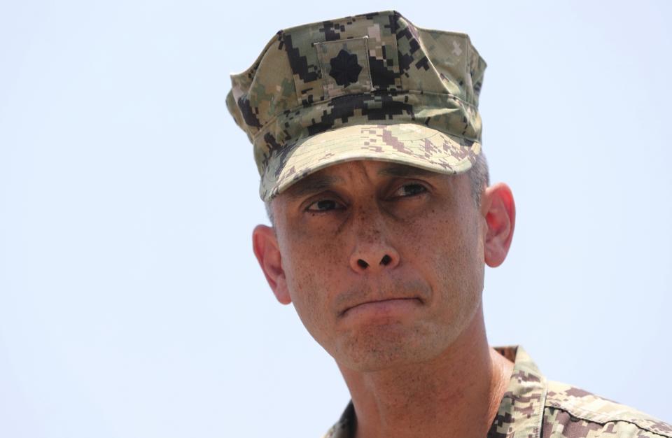 Cmdr. Sean Kido of the U.S. Navy's 5th Fleet speaks to journalists at a 5th Fleet Base, during a trip organized by the Navy for journalists, near Fujairah, United Arab Emirates, Wednesday, June 19, 2019. Kido said Wednesday that the limpet mine used on a Japanese-owned oil tanker last week "bears a striking resemblance" to similar Iranian mines. (AP Photo/Kamran Jebreili)