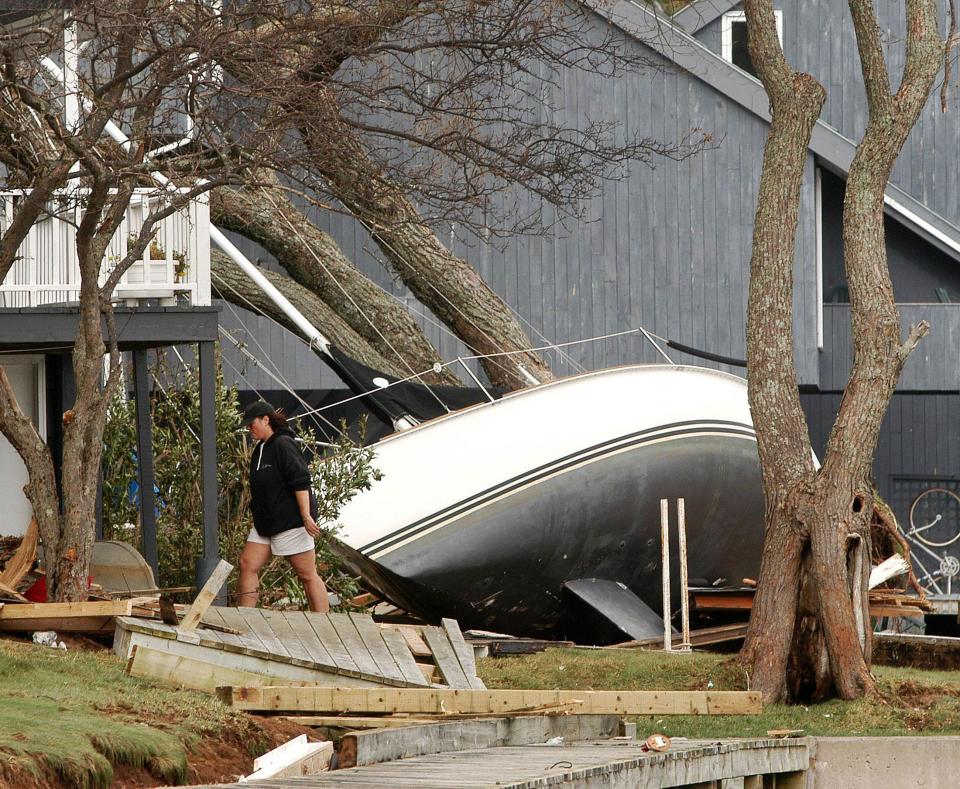 A resident of Bedford, Nova Scotia walks past a boat which washed
ashore in the front yard of a home in the aftermath of Hurricane Juan,
September 29, 2003. Two people were dead and 80,000 without power in
Nova Scotia Monday morning after Hurricane Juan barreled into the
eastern Canadian province from the Atlantic Ocean overnight. Juan was
still lashing the Atlantic region Monday, but had been downgraded to a
tropical storm after hitting Halifax, Nova Scotia's biggest city and
one of the country's largest ports, with with winds of up to 140 km/h
(90mph.) A state of emergency was declared in the city. REUTERS/Paul
Darrow

PD/GN