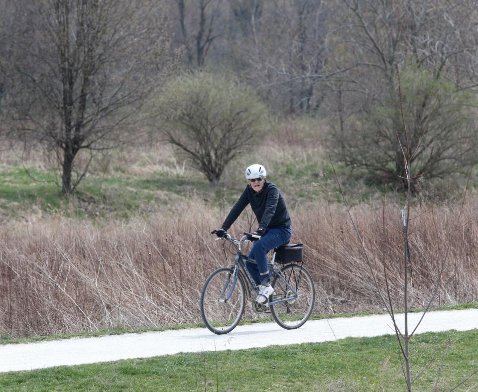 A cyclist makes his way through Veterans Park in Stark County's Plain Township in 2021.