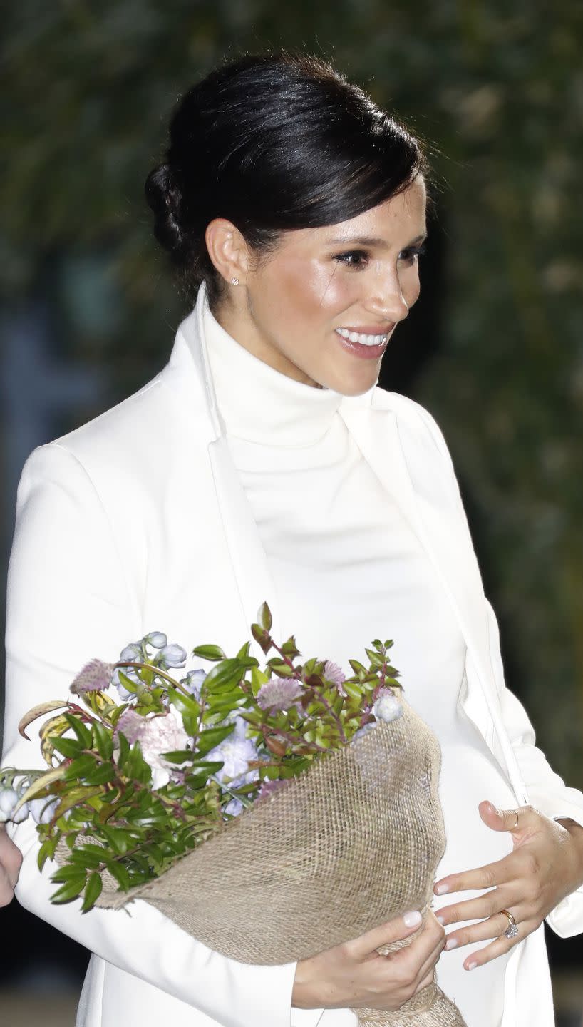 Meghan received a bouquet of flowers upon arrival.