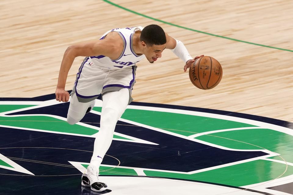 Sacramento Kings' Tyrese Haliburton suffers an unknown leg injury during an NBA basketball game against the Dallas Mavericks in Dallas, Sunday, May 2, 2021. (AP Photo/Tony Gutierrez)