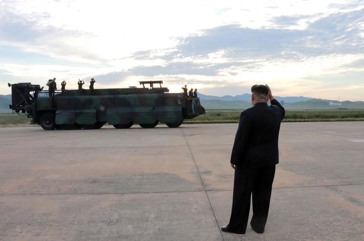 In an unverified image released by North Korea's news agency, Kim Jong-un is shown inspecting a launching drill of the medium-and-long-range strategic ballistic rocket Hwasong-12: AFP/Getty