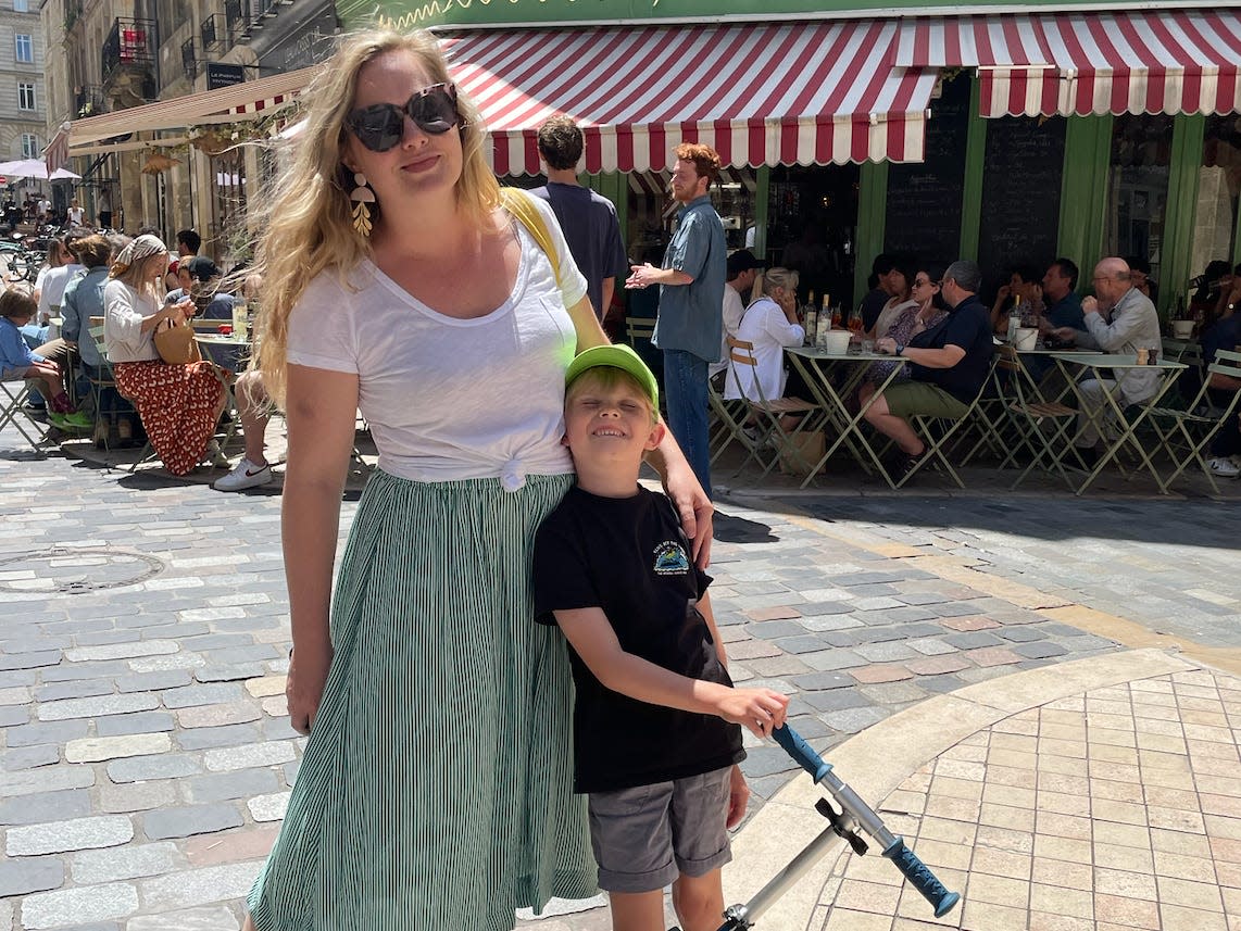 Mom and son posing for photo in France