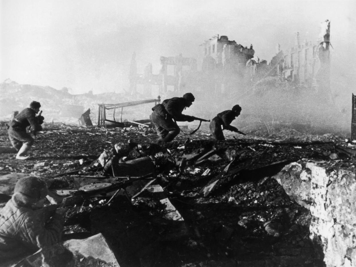 1941:  Red Army troops storming an apartment block amidst the ruins of war-torn Stalingrad during World War II. (Georgi Zelma/Slava Katamidze Collection/Getty Images)
