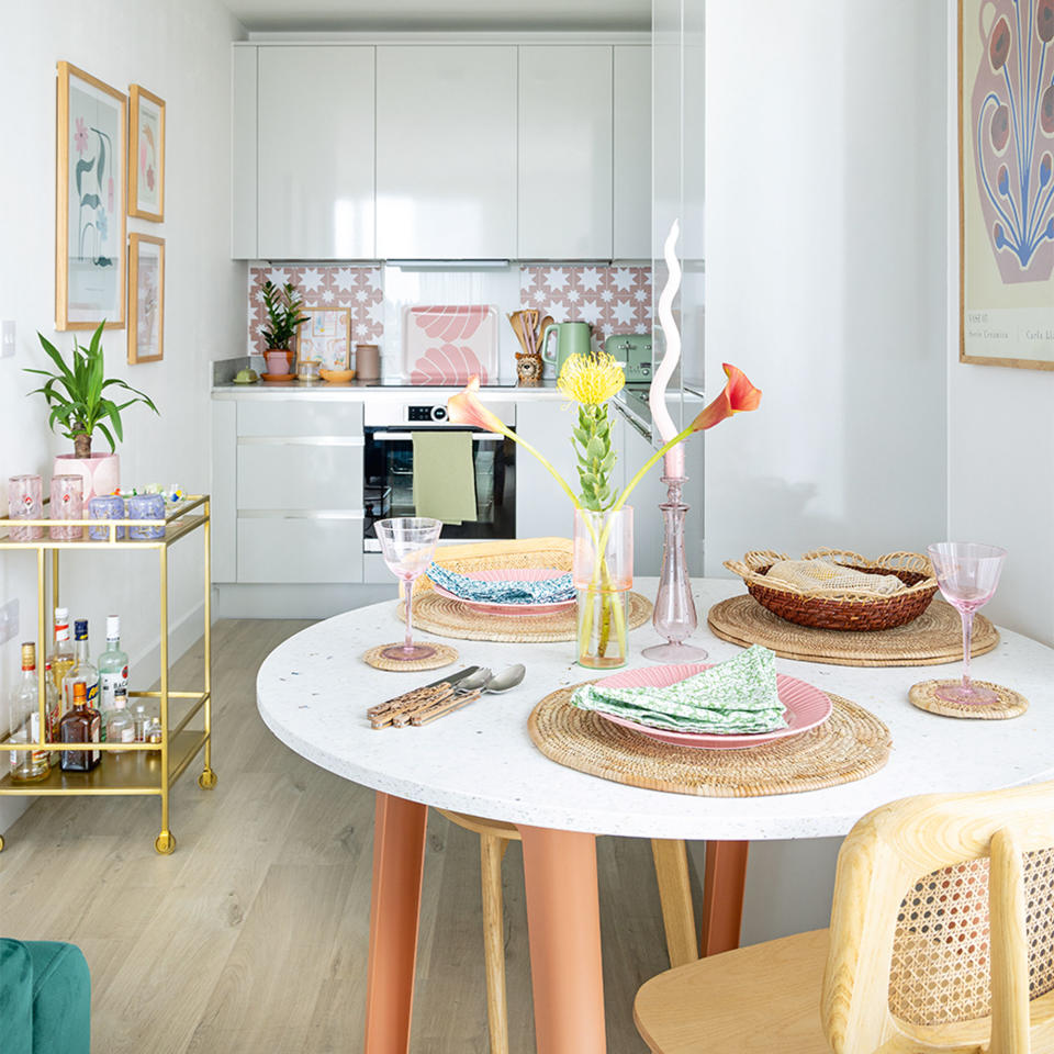 dining area with round dining table and grey kitchen