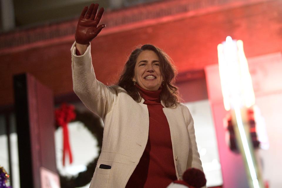 Knoxville Mayor Indya Kincannon waves at the 49th annual WIVK Christmas Parade along Gay Street in downtown Knoxville, Tenn., on Friday, Dec. 2, 2022.