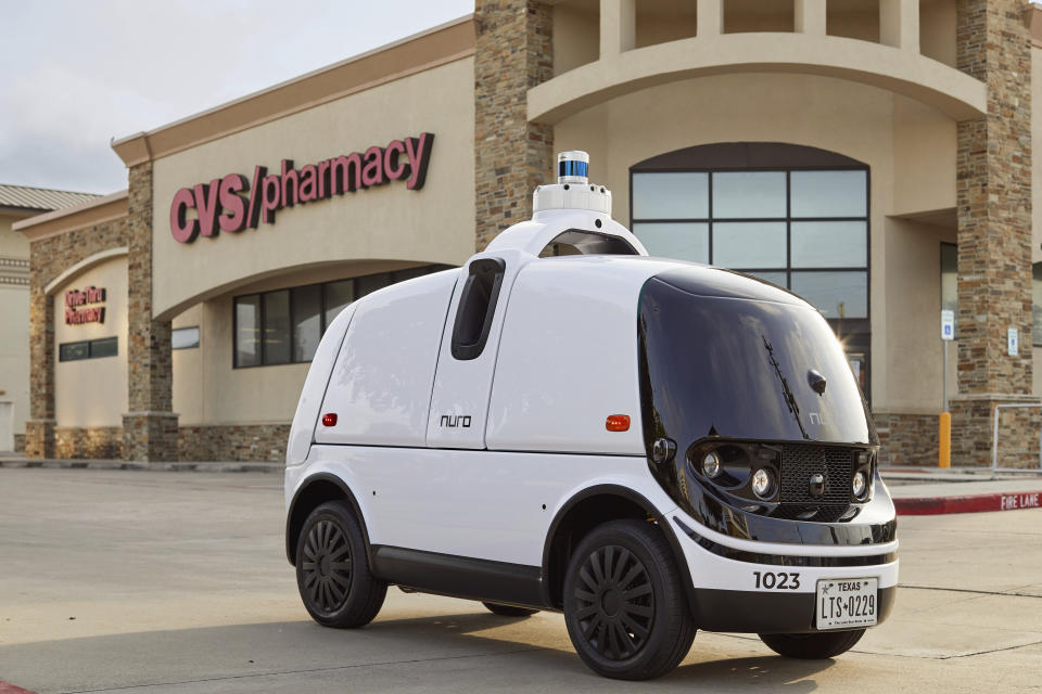 This photo provided by Nuro shows a Nuro vehicle in front of a CVS Pharmacy. CVS Health said Thursday, May 28, 2020 it will partner with Silicon Valley robotics company Nuro on deliveries of medicines and other products to customers near a Houston-area store (Nathan Lindstrom/Nuro via AP)
