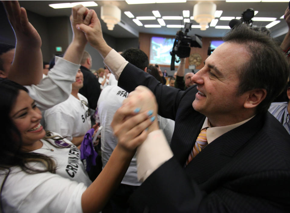 Gavin Maloof, co-owner of the Sacramento Kings, celebrates with Kings fans after the Sacramento City Council approved a plan to help finance a new $391 sports and entertainment arena, in Sacramento, Calif. Tuesday, March 6, 2012. By a 7-2 vote, the City Council approved a non-binding term sheet, signed off by the Kings and the NBA last week, that will keep the team in Sacramento for at least another 30 years.(AP Photo/Rich Pedroncelli)