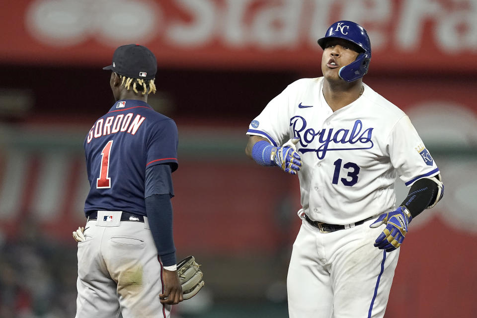 Kansas City Royals' Salvador Perez (13) celebrates on second after hitting an RBI double during the seventh inning of a baseball game against the Minnesota Twins Tuesday, Sept. 20, 2022, in Kansas City, Mo. (AP Photo/Charlie Riedel)