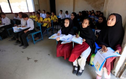 Children attend a class at the Khushal school in Mingora, which Malala Yousafzai used to attend  - Credit:  FAISAL MAHMOOD/Reuters