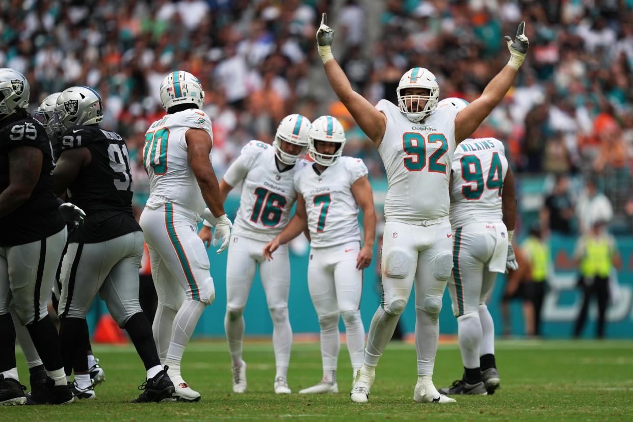 Miami Dolphins defensive tackle Zach Sieler (92) celebrates a field goal by place kicker Jason Sanders (7) during the second half of an NFL game against the Las Vegas Raiders at Hard Rock Stadium in Miami Gardens, Nov. 19, 2023.