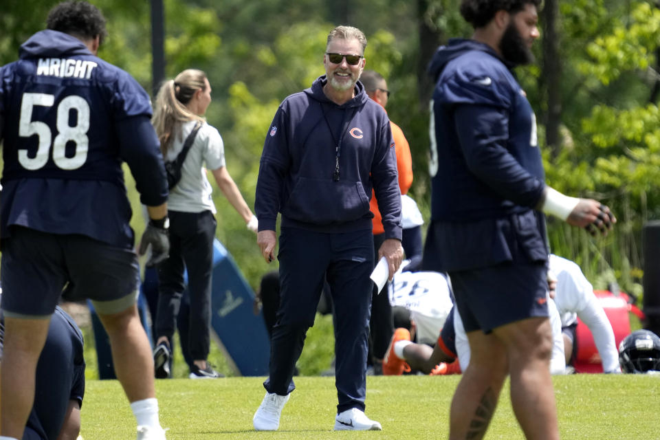 Chicago Bears head coach Matt Eberflus smiles as he watches players during NFL football practice in Lake Forest, Ill., Friday, May 31, 2024. (AP Photo/Nam Y. Huh)