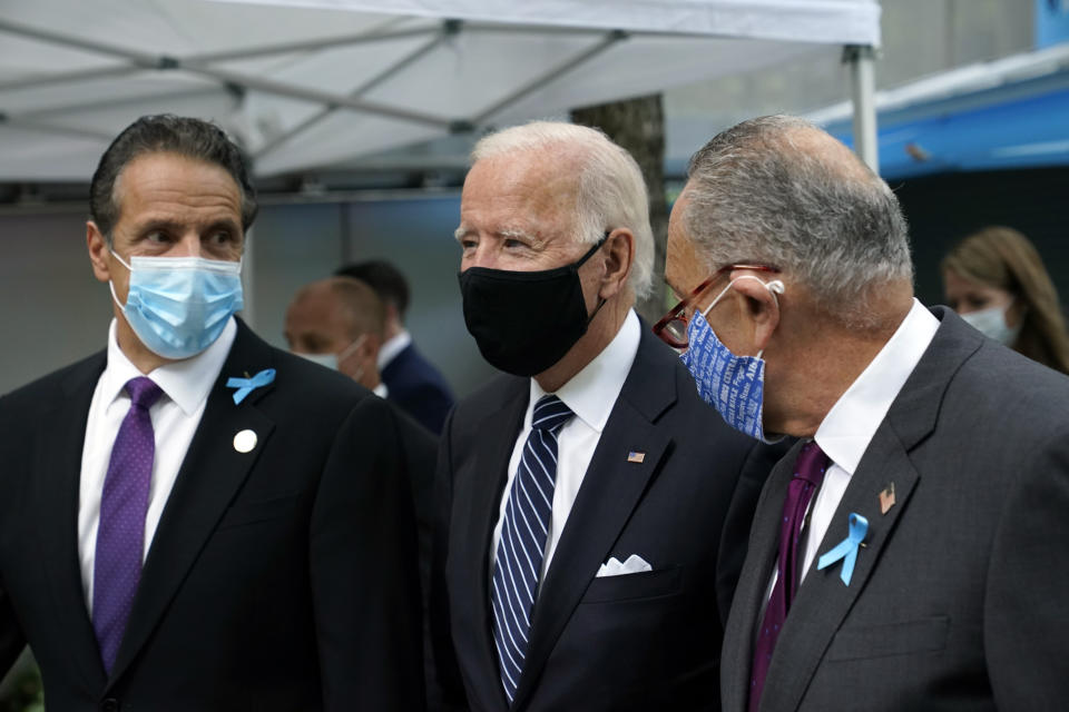 Democratic presidential candidate and former Vice President Joe Biden walks Sen. Chuck Schumer, D-N.Y., right, and New York Gov. Andrew Cuomo, at the National September 11 Memorial in New York, Friday, Sept. 11, 2020, before a ceremony marking the 19th anniversary of the Sept. 11 terrorist attacks. (AP Photo/Patrick Semansky)