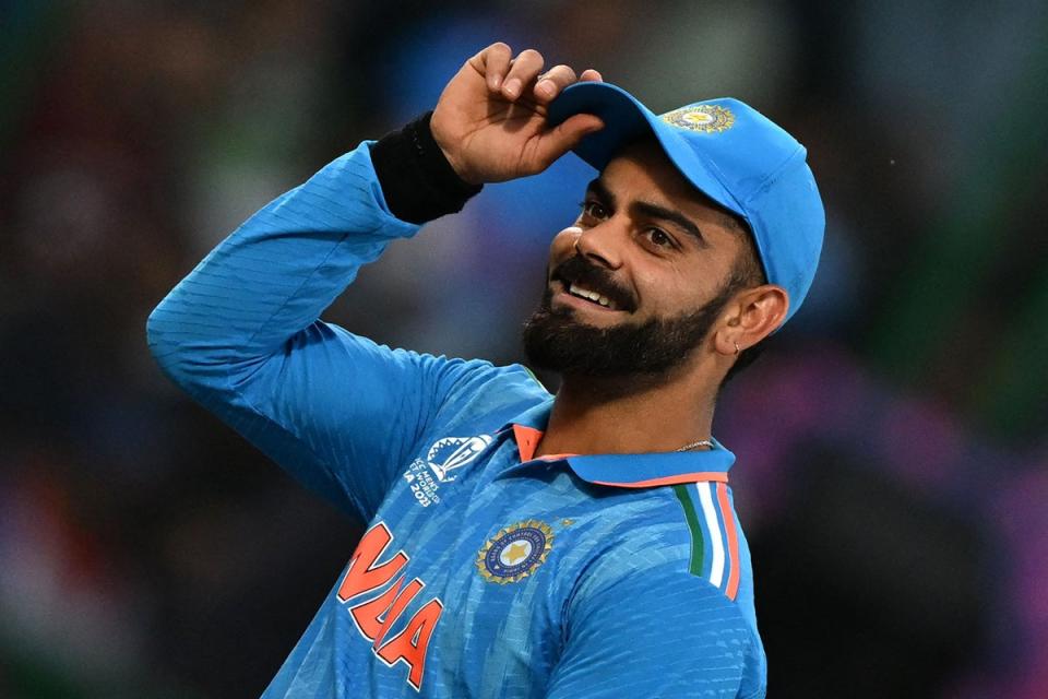 Virat Kohli gestures to spectators during the 2023 ICC Men’s Cricket World Cup one-day international (ODI) match between India and Afghanistan at the Arun Jaitley Stadium in New Delhi on 11 October (AFP via Getty Images)