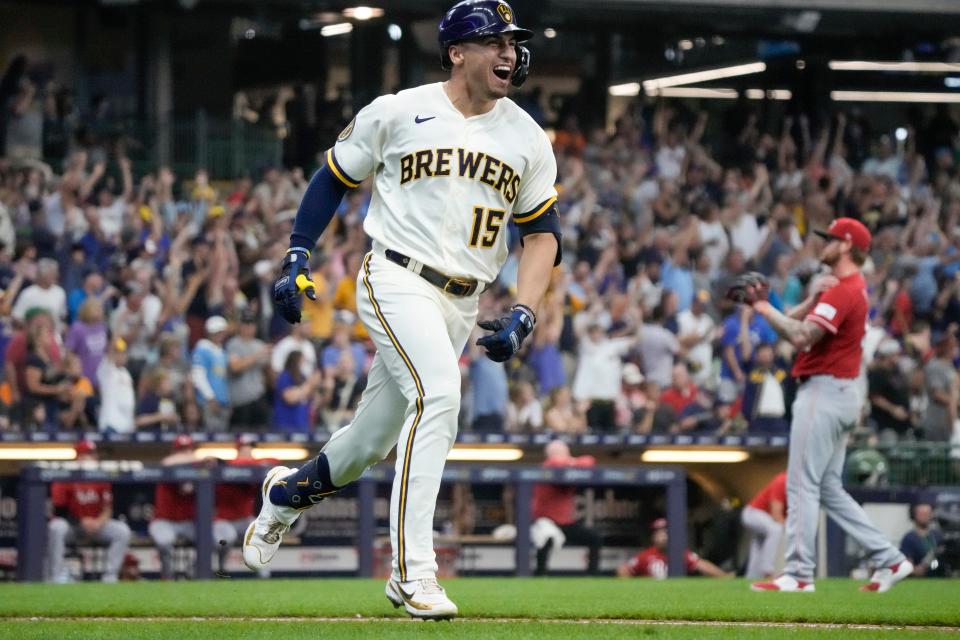 Milwaukee Brewers' Tyrone Taylor reacts after hitting a two-run home run during the seventh inning of a baseball game against the Cincinnati Reds Wednesday, July 26, 2023, in Milwaukee.