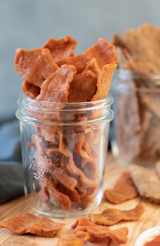 <p>My Quiet Kitchen</p><p>Buffalo and Thai peanut flavors join the vegan jerky party! High in plant protein and with an oil-free option, this homemade vegan jerky is a tasty and healthy snack.</p><p><strong>Get the recipe: <a href="https://myquietkitchen.com/seitan-jerky-buffalo-and-thai-peanut/" rel="nofollow noopener" target="_blank" data-ylk="slk:Buffalo and Thai Peanut Seitan Jerky;elm:context_link;itc:0;sec:content-canvas" class="link ">Buffalo and Thai Peanut Seitan Jerky</a></strong></p>