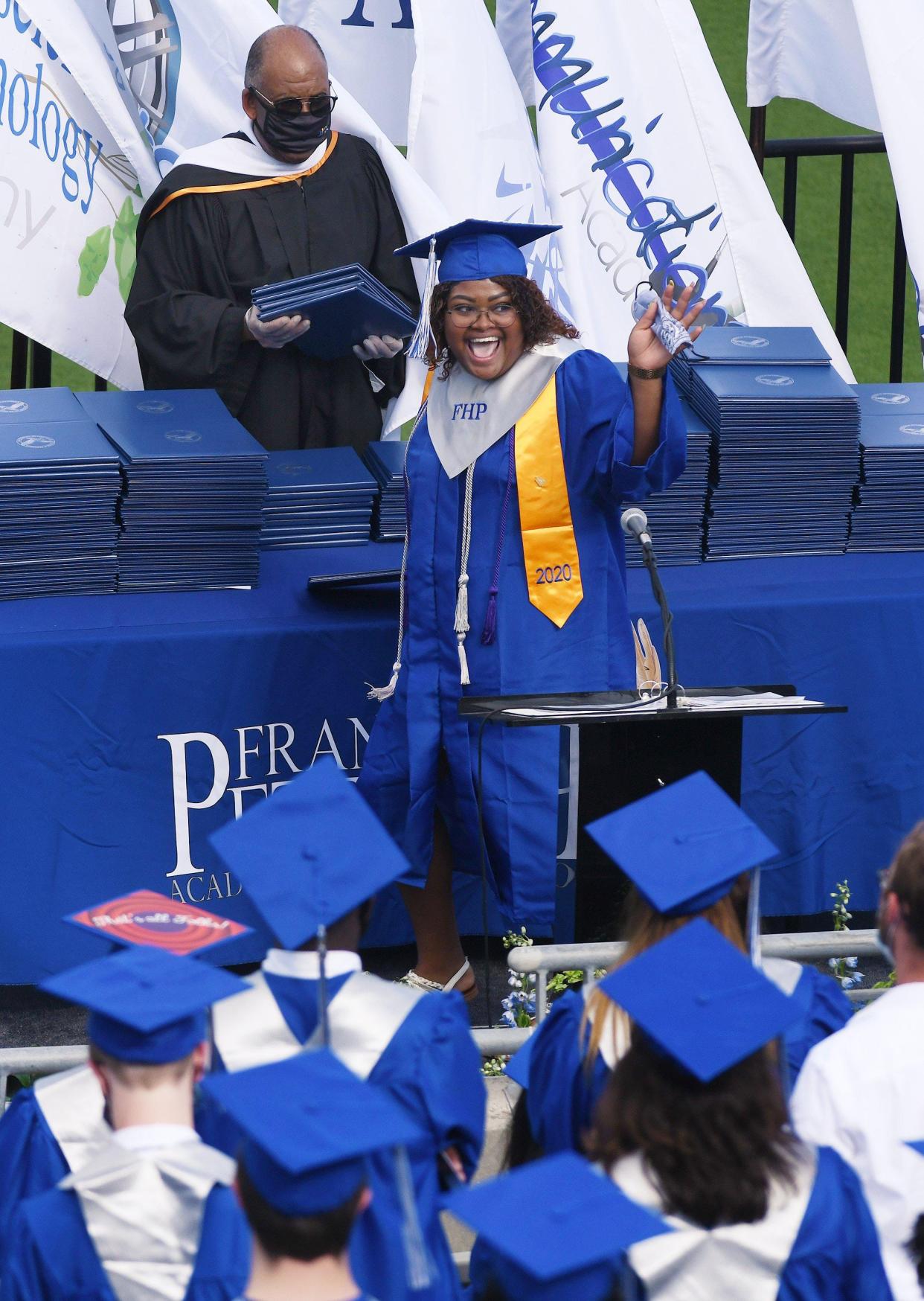 Graduates of the Frank H. Peterson Academies of Technology received diplomas from then-School Board Chairman Warren Jones in this 2020 photo.