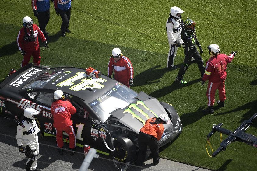 Kurt Busch (41) waves to fans after hitting the wall along the front stretch during a NASCAR Clash auto race at Daytona International Speedway in Daytona Beach, Fla., Sunday, Feb. 19, 2017. (AP Photo/Phelan M. Ebenhack)