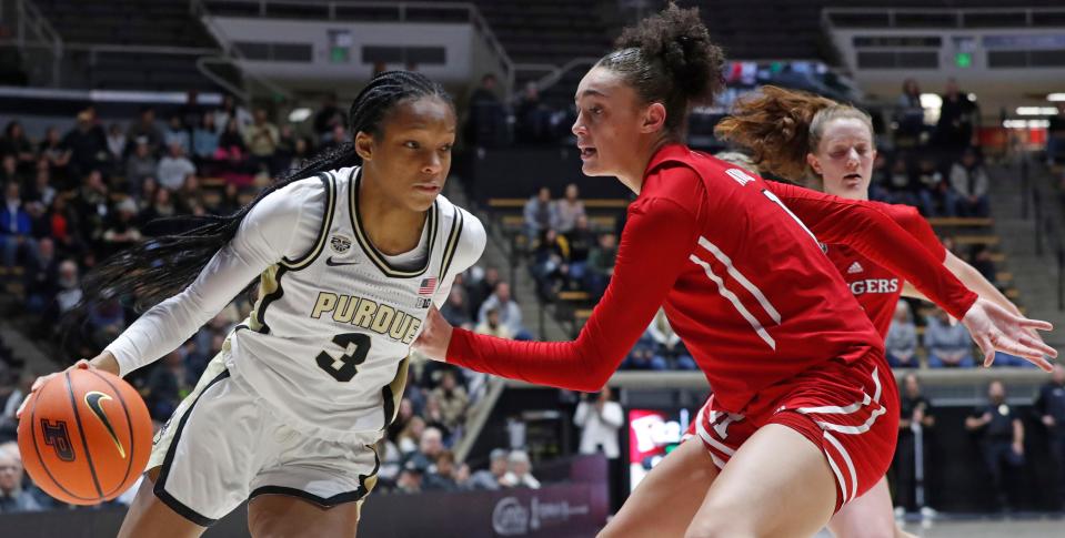 Purdue Boilermakers guard Jayla Smith (3) drives past Rutgers Scarlet Knights guard Destiny Adams (1) during the NCAA women’s basketball game, Tuesday, Jan. 2, 2024, at Mackey Arena in West Lafayette, Ind.