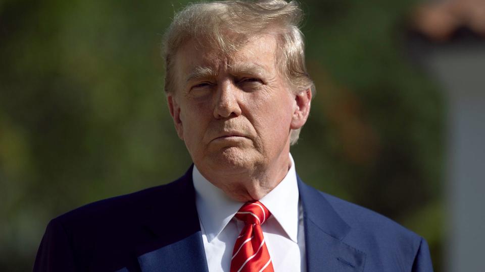 Former U.S. President Donald Trump speaks to media members after voting in the Presidential Preference Primary in Palm Beach, Florida. (Photo by Joe Raedle/Getty Images)