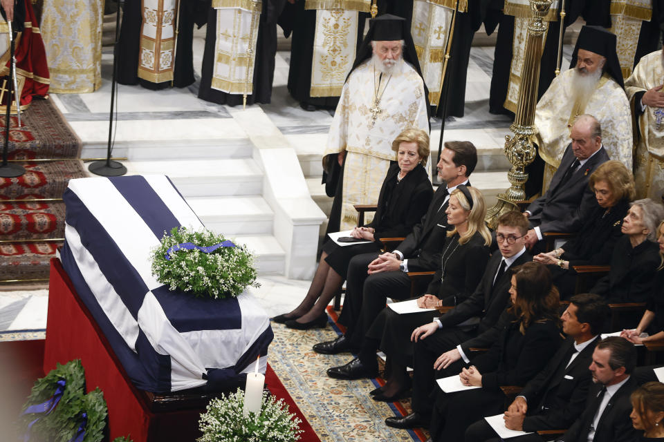 Greece's former Queen Anne Marie, former Crown Prince Pavlos and Princess Marie-Chantal, seen first row, former Spanish King Juan Carlos and Queen Sofia, second row, attend the funeral service of former king of Greece Constantine II at Metropolitan Cathedral in Athens, Monday, Jan. 16, 2023. Constantine died in a hospital late Tuesday at the age of 82 as Greece's monarchy was definitively abolished in a referendum in December 1974. (Stoyan Nenov/Pool via AP)