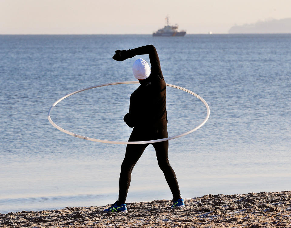 A man exercises at the beach in Timmendorfer Strand, Germany