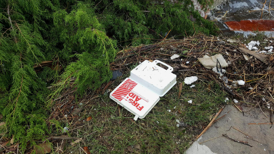 A first aid kit is among the debris strewn about by the storm.