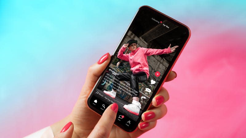 social media app interface on mobile phone showing shared video content on TikTok