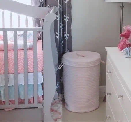 the hamper in pink in a nursery