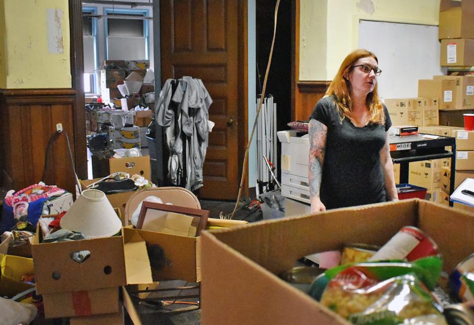 Faith Bon Jovi, a volunteer with Gates of Hope is in the process of moving everything from the food pantry that operates in the former Davol School in Fall River.