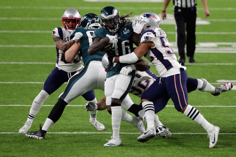 <p>Jay Ajayi #36 of the Philadelphia Eagles is tackled by Elandon Roberts #52 of the New England Patriots during the first quarter in Super Bowl LII at U.S. Bank Stadium on February 4, 2018 in Minneapolis, Minnesota. (Photo by Streeter Lecka/Getty Images) </p>